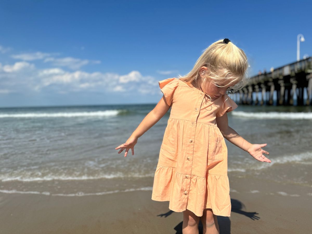 vignette, orange, button front dress, with flutter sleeves.