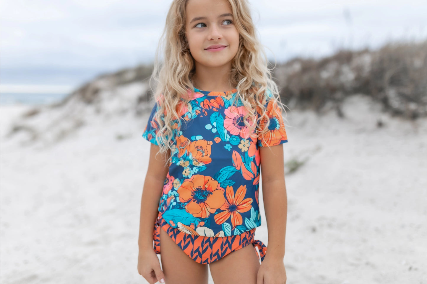 Oopsie Daisy Kid's Navy & Orange Floral Short Sleeve Rash Guard Swimsuit