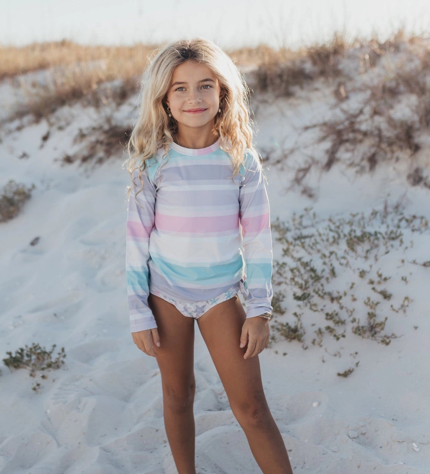 Oopsie Daisy Kid's Pastel Star Fish Long Sleeve Ruffle Rash Guard Swimsuit