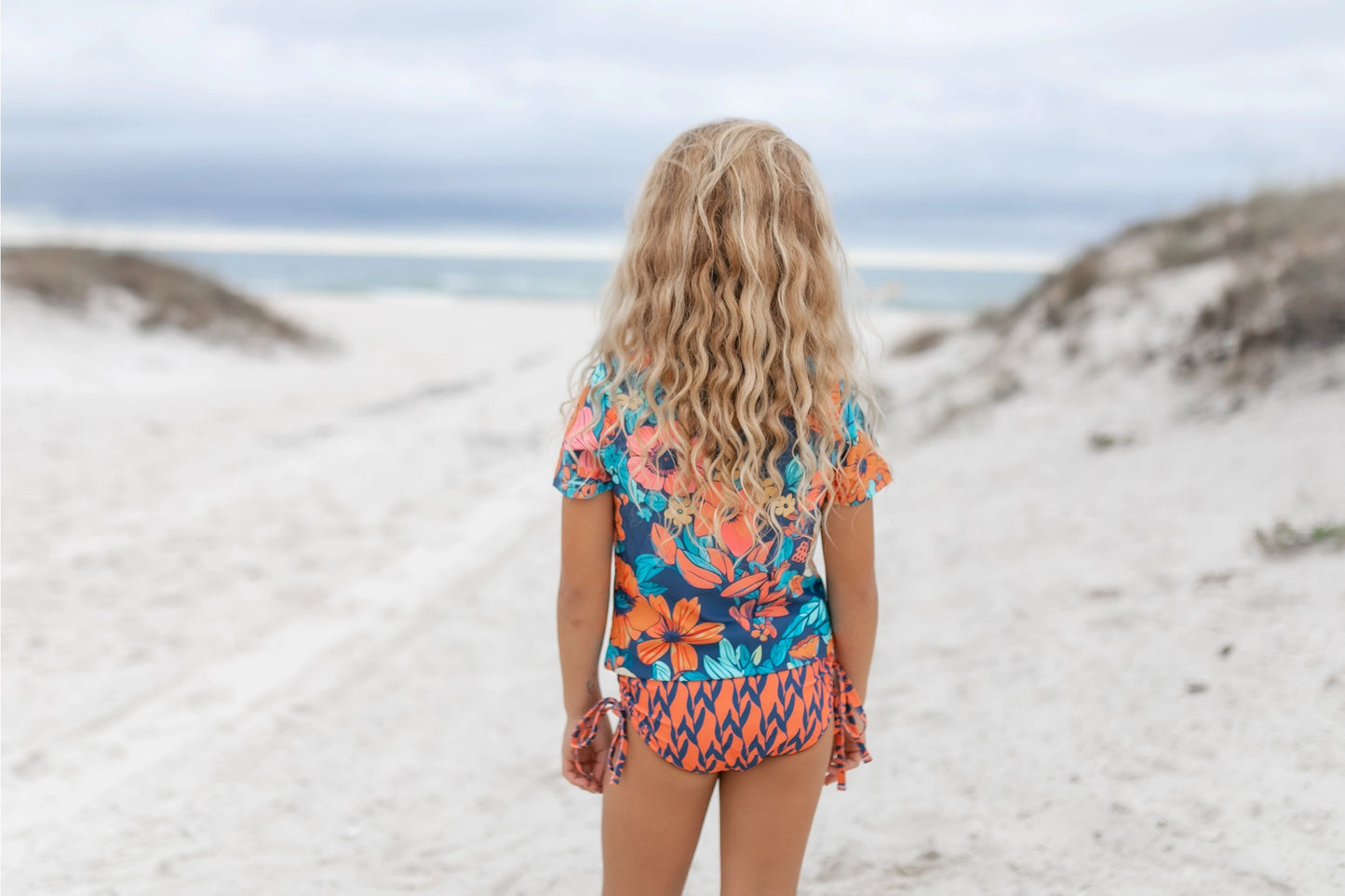Oopsie Daisy Kid's Navy & Orange Floral Short Sleeve Rash Guard Swimsuit