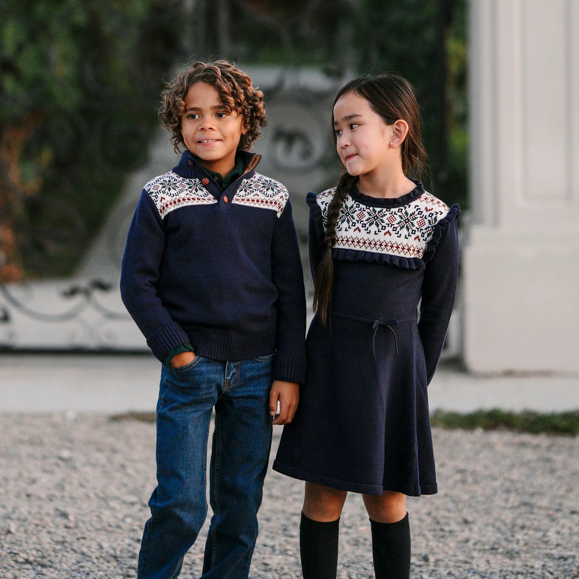children wearing sustainable Christmas sweaters for winter holidays
