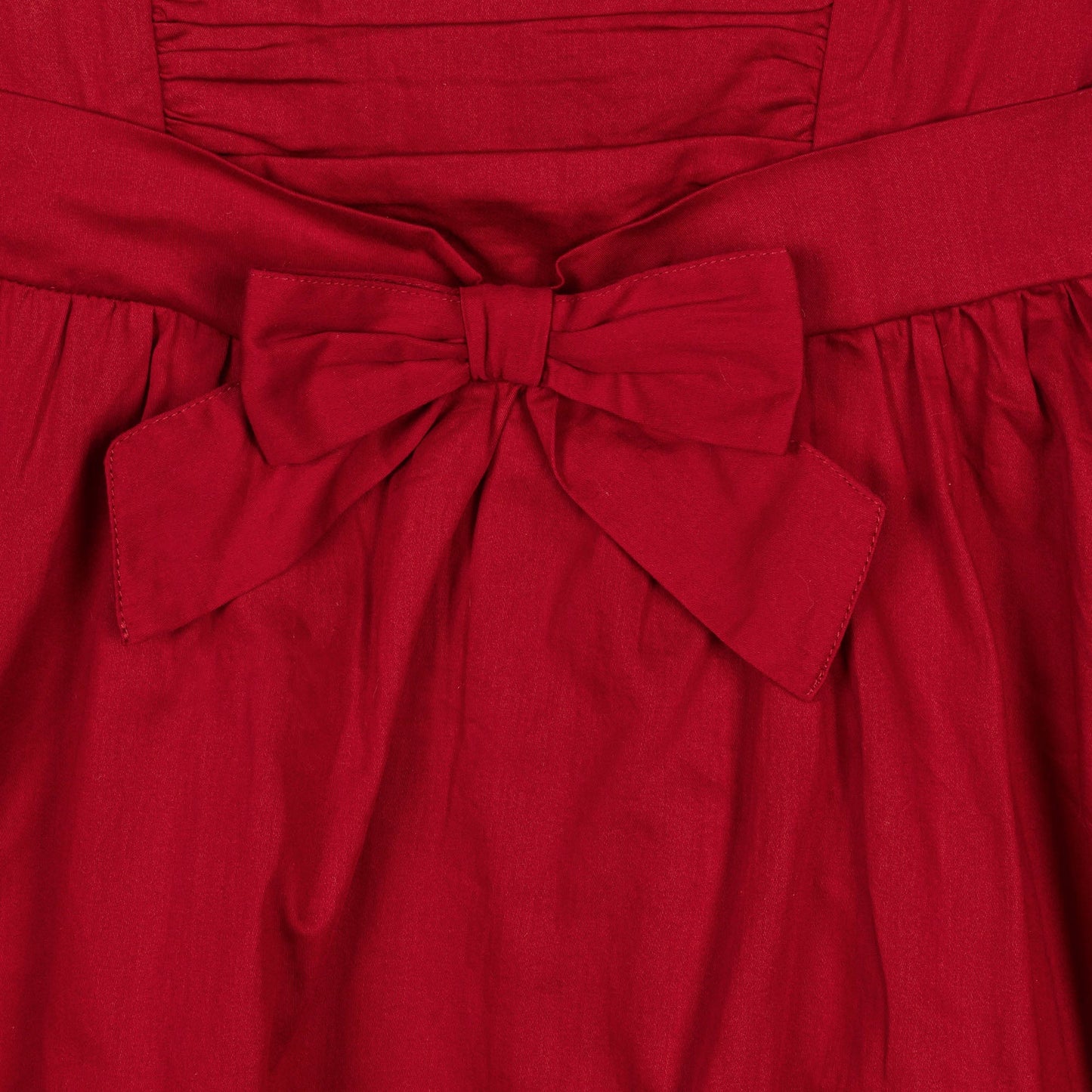 sustainable red holiday dress with high low hem