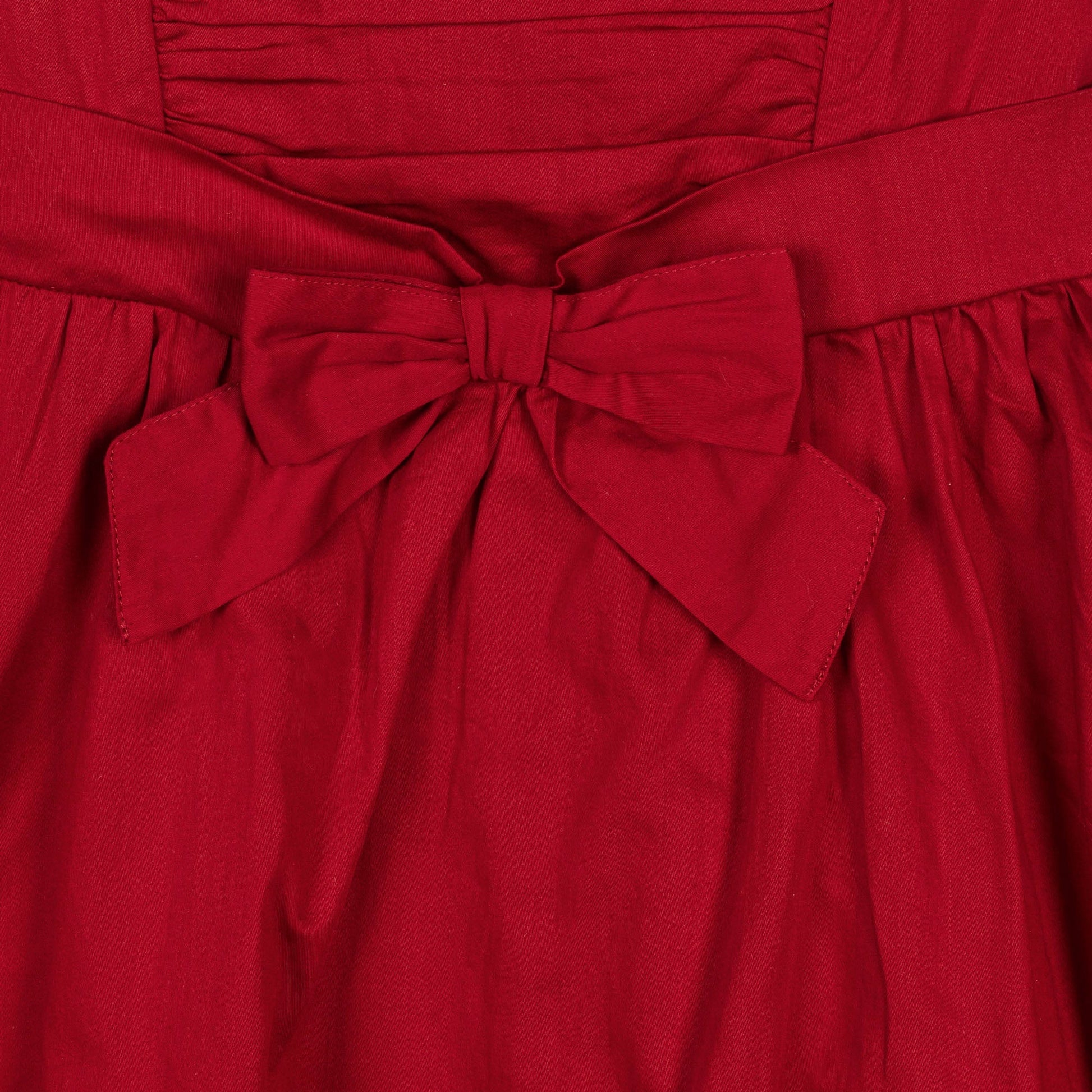 sustainable red holiday dress with high low hem