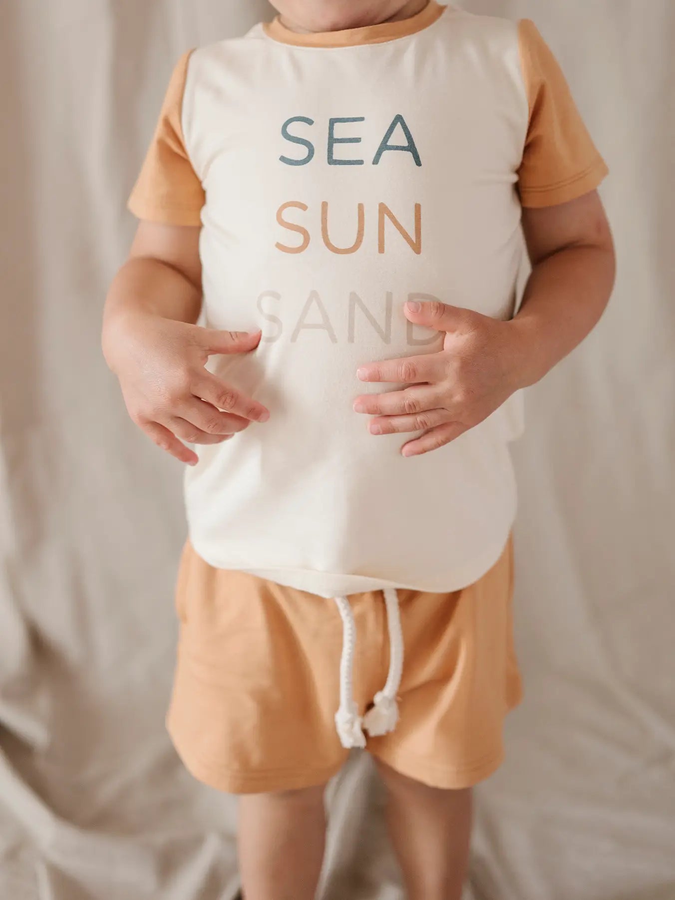 Child wearing Babysprouts Clothing Company Pocket Colorblock Tee - Sea Sun Sand