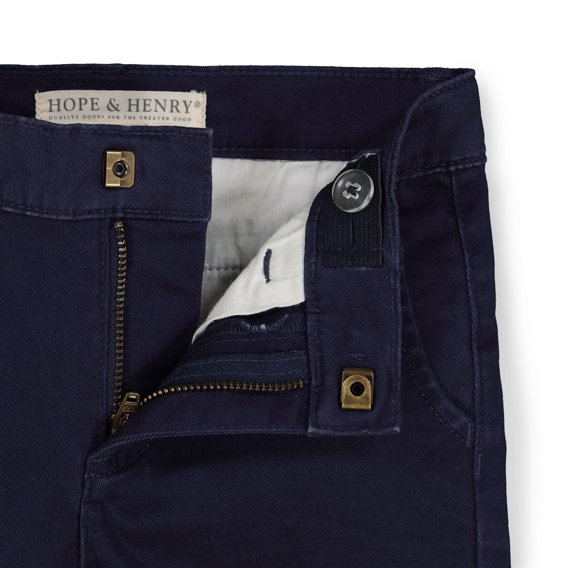 Navy blue pants with gold buttons and zippers, featuring the brand 'Hope & Henry'.
