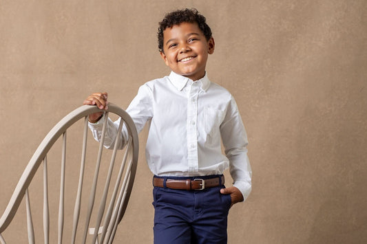 young boy with organic cotton clothing posing for photograph