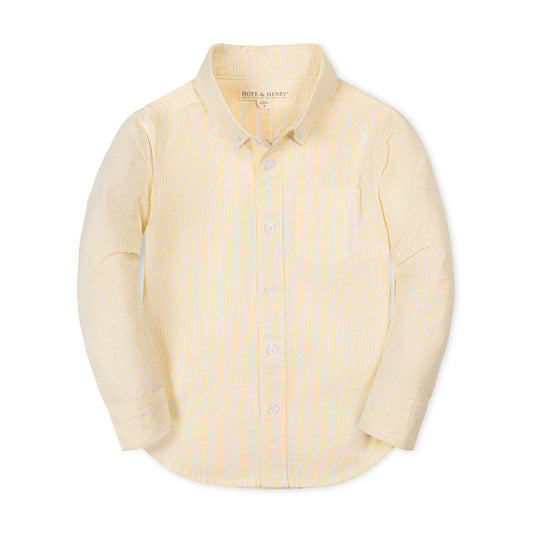 Light yellow seersucker button-up collared shirt on a white background