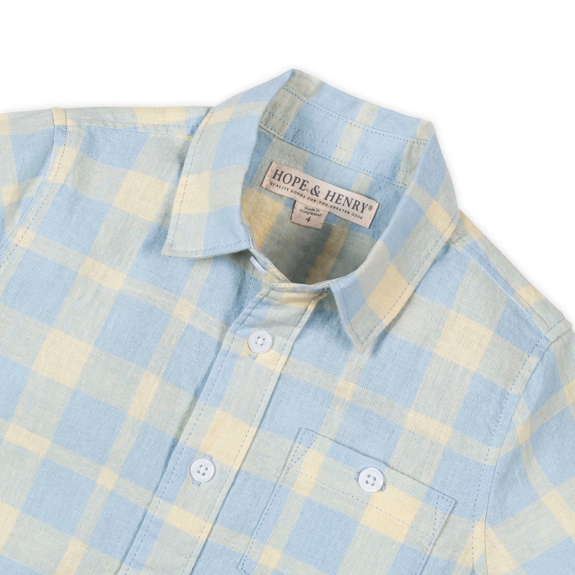 Blue and yellow plaid short sleeve collared shirt on a white background