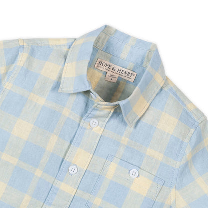 Blue and yellow plaid short sleeve collared shirt on a white background