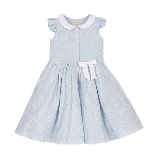Light blue floral easter dress with white collar and bow on a white background