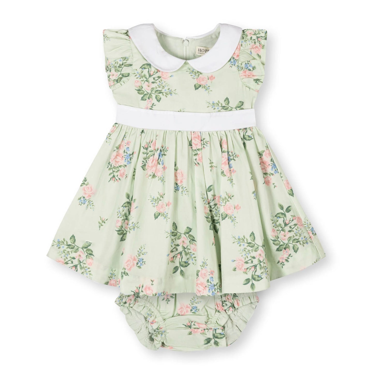 Green floral baby dress with pink and blue floral pattern with white collar on a white background