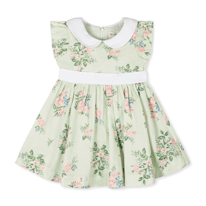 Green floral baby dress with pink and blue floral pattern with white collar on a white background