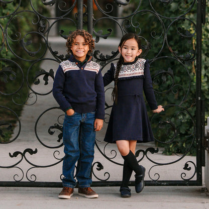 children wearing organic cotton Christmas dress with snowflake knit design