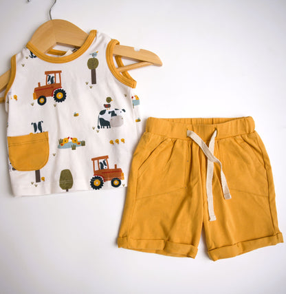 Viverano Organics baby playsuit set with a farm animal print, including a sleeveless tee and shorts in orange, with a white sash tie at the waist.