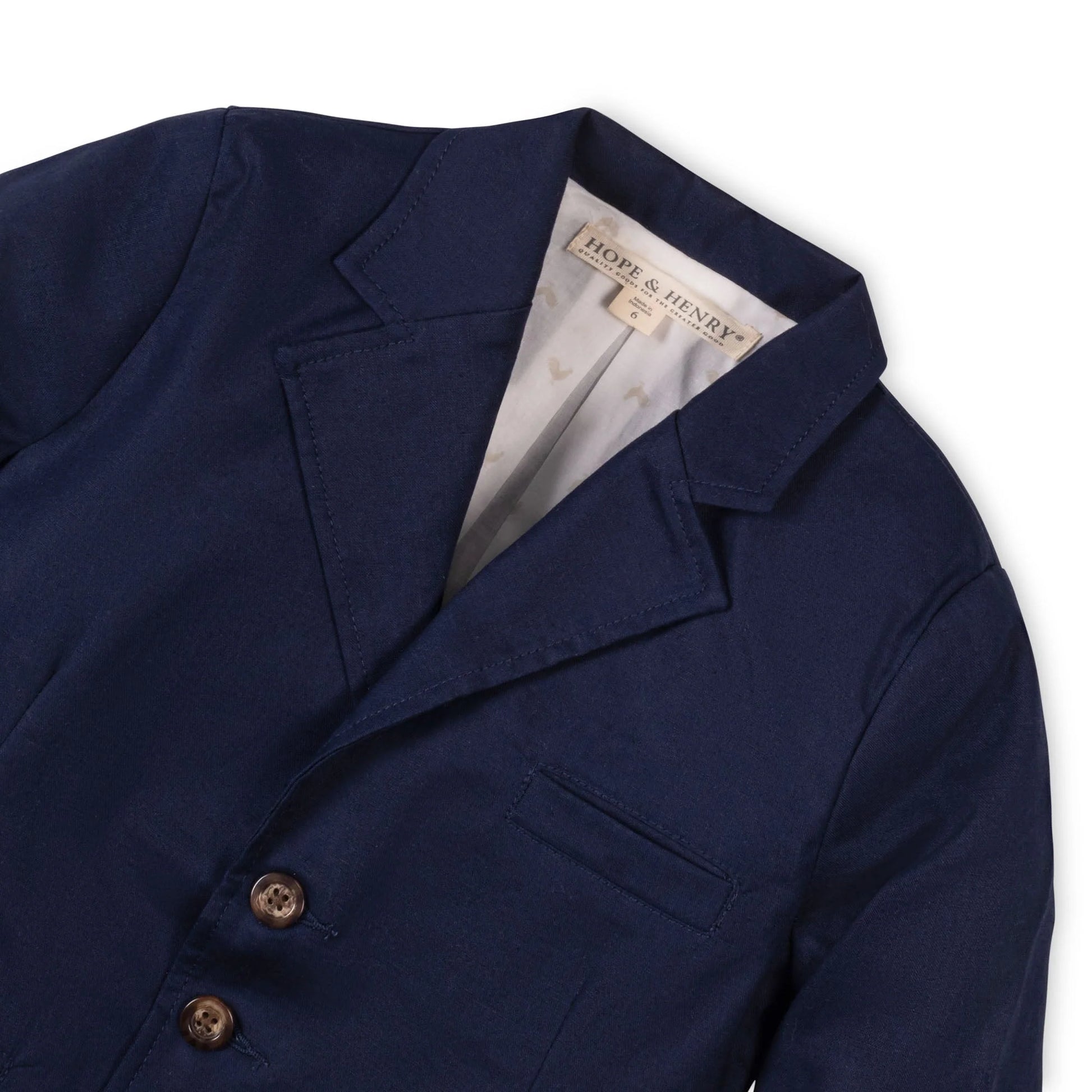 collar view of Boys navy blue suit jacket in a premium 55% linen and 45% organic cotton blend