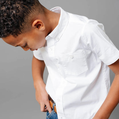 Model call of Boys white short sleeve organic cotton stretch poplin button-down shirt by Hope and Henry.
