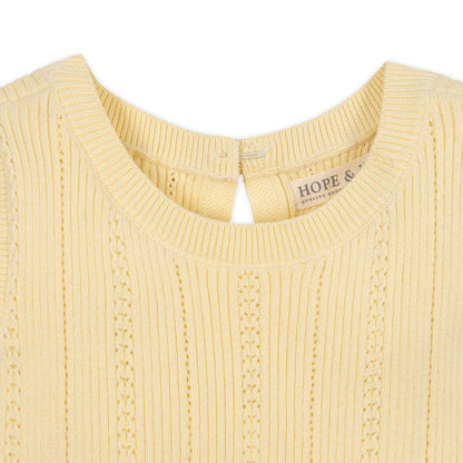 collar view of Yellow organic cotton knit sweater dress for girls with a flounce hem by Hope and Henry.