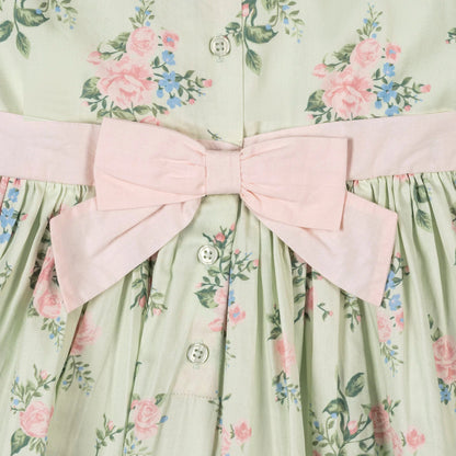 Hope and Henry girls green floral dress in 100% organic cotton sateen with pearlized button back, closeup of bow