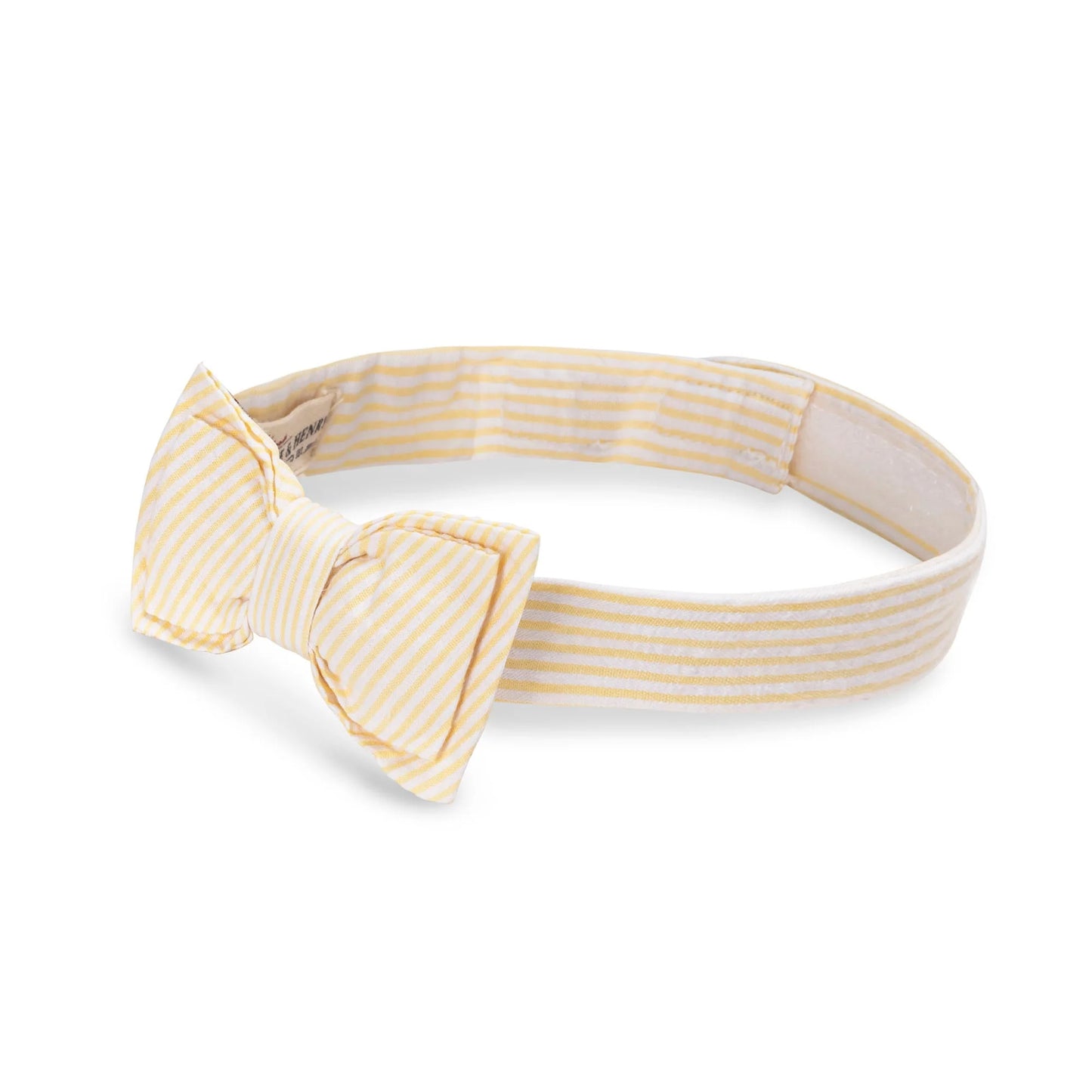 left view of Adjustable boys seersucker bow tie made of 100% organic cotton by Hope and Henry.