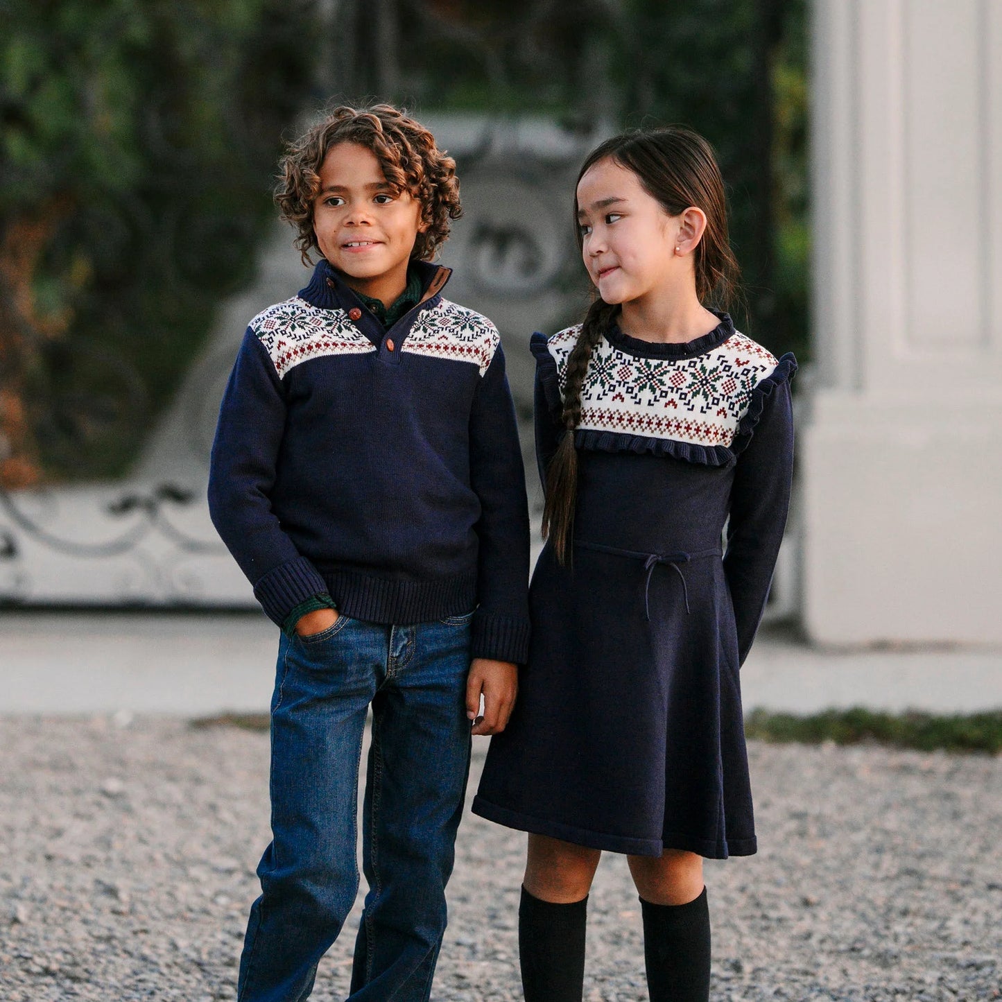 children wearing sustainable Christmas sweaters for winter holidays