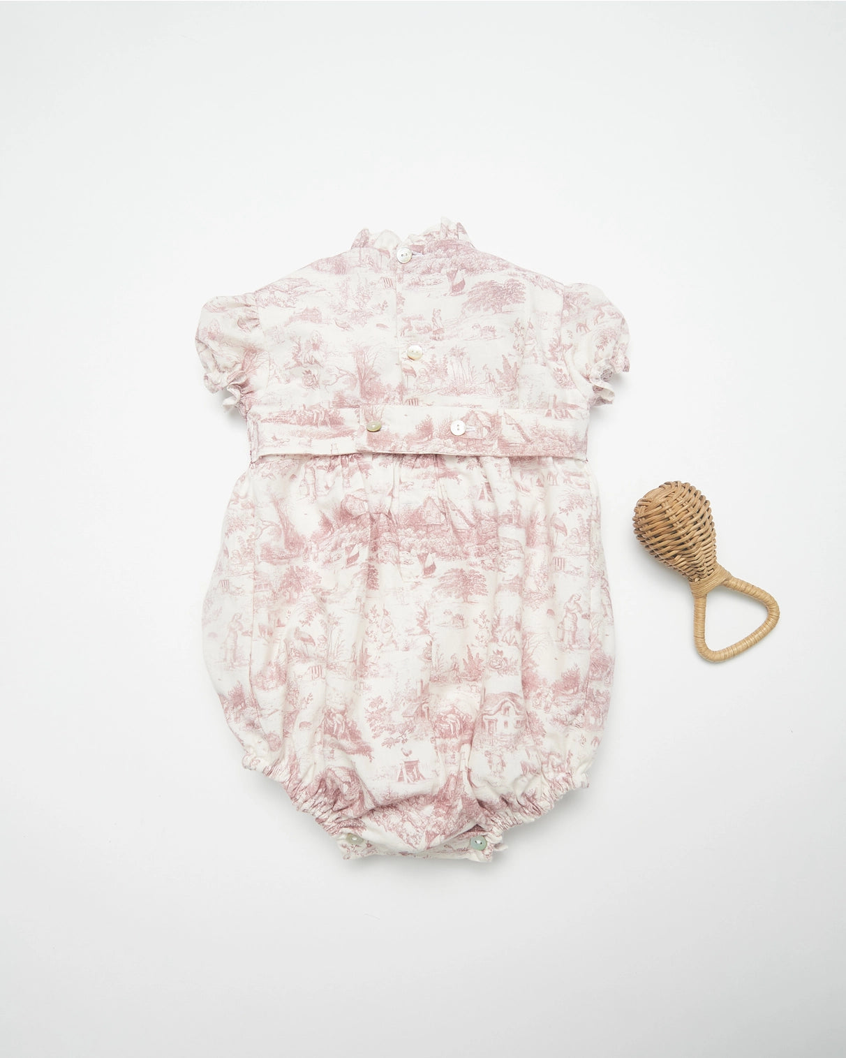 Pi & Pa, smocked romper with a mauve and white toile fabric, ruffled neck and cap sleeves