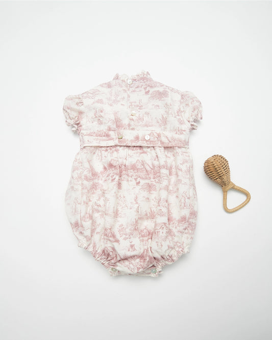 Pi & Pa, smocked romper with a mauve and white toile fabric, ruffled neck and cap sleeves