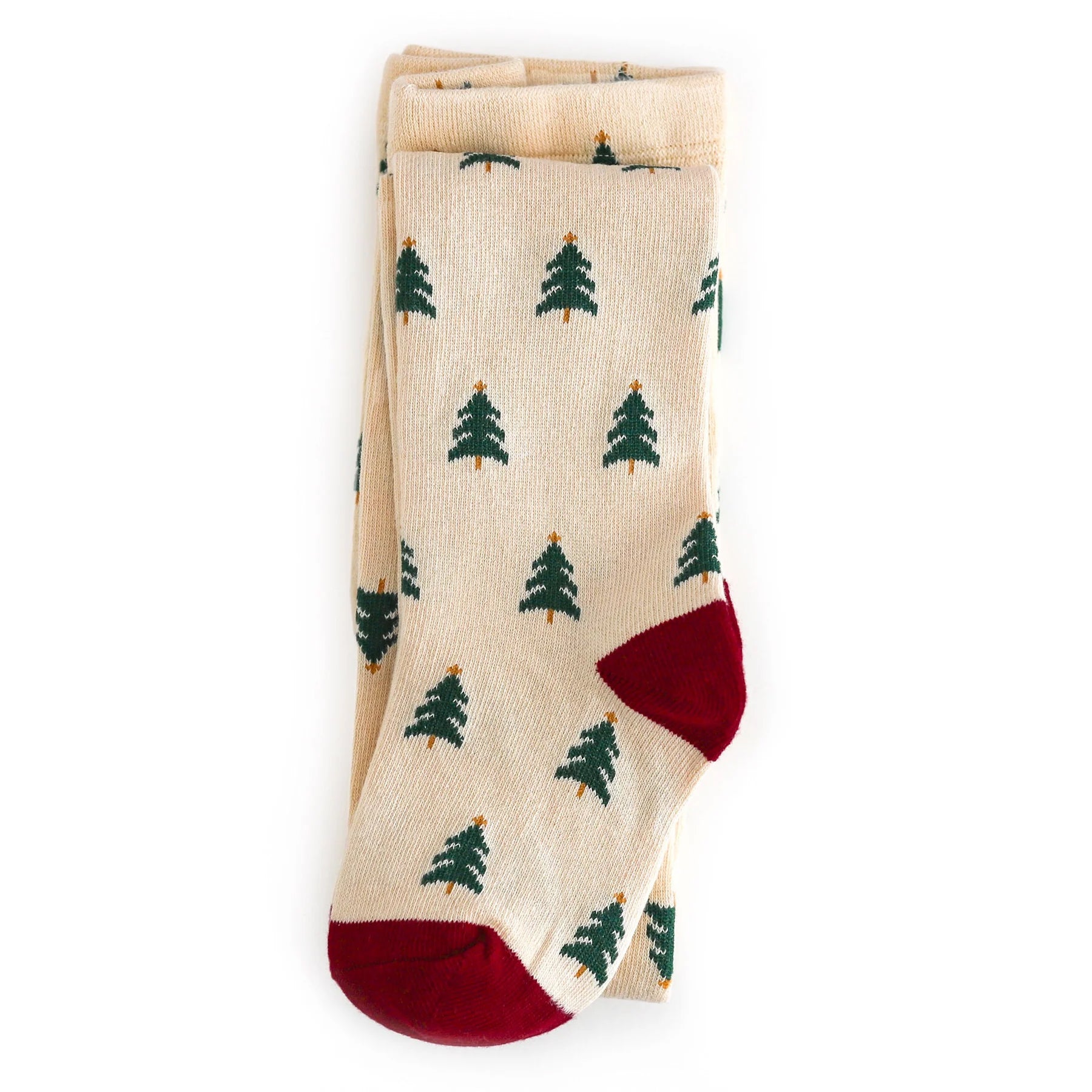 Cream stocking with green tree pattern and red accents on a cream background